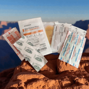 Medical supplies on a rocky surface outdoors.